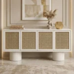 Modern-plaster-finish-buffet-with-cane-panel-doors-open-showing-internal-shelves-and-cylindrical-pedestal-legs-2.webp